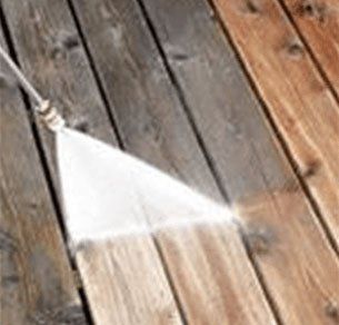 Pressure Washing and Cleaning a dirty wooden Deck